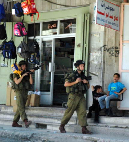 Israeli soldiers on patrol in West Bank. Photo by Justin McIntosh, retrieved from Wikipedia.